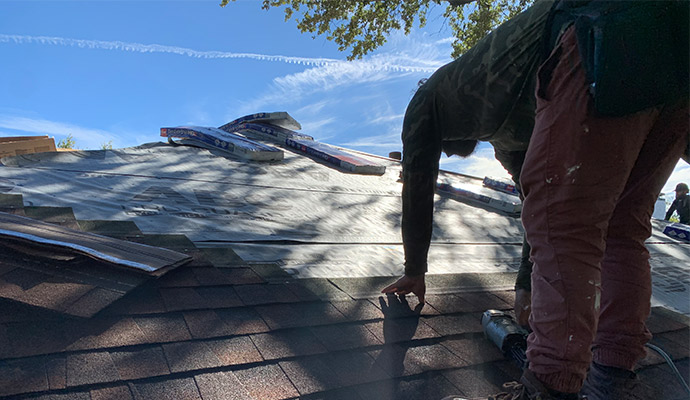 Man Replacing Roof